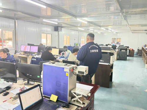 Production workshop of conveyor roller manufacturer showing engineering and manufacturing operations