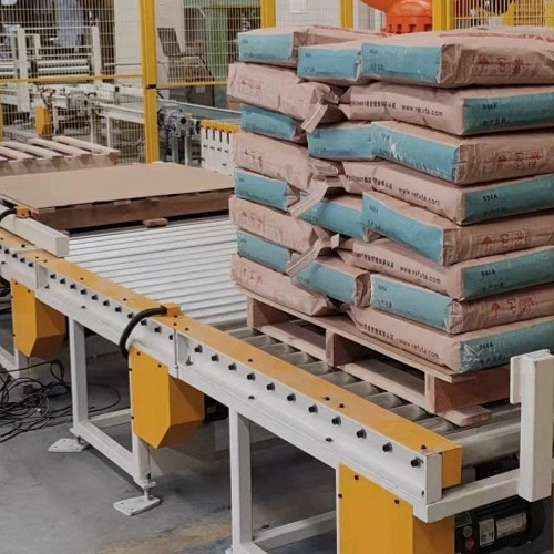 chain driven pallet conveyor roller system for synchronized powered material transfer