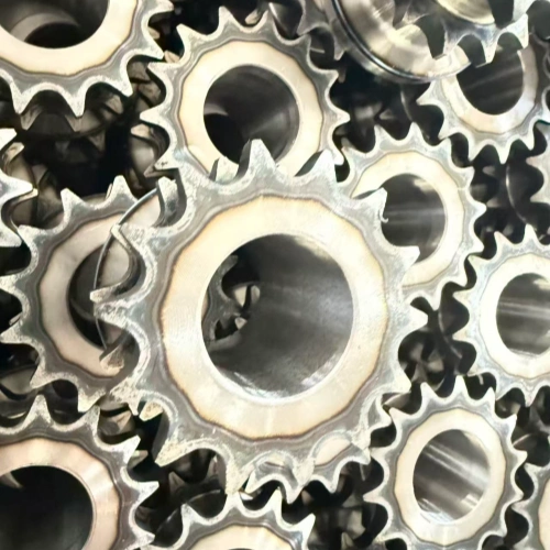 Hardened sprocket roller shaft with the bearing seat left unmachined before final grinding