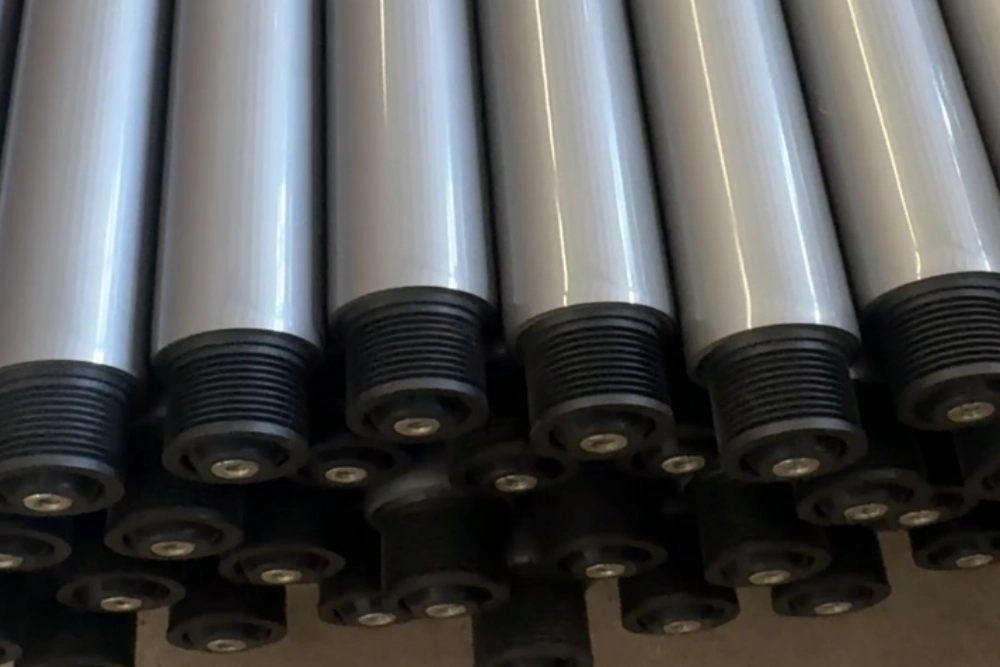 Grey PVC-sleeved poly V conveyor rollers with PJ pulleys