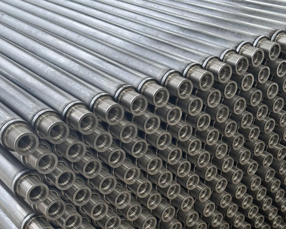 Welded steel poly V conveyor rollers stacked and awaiting plating