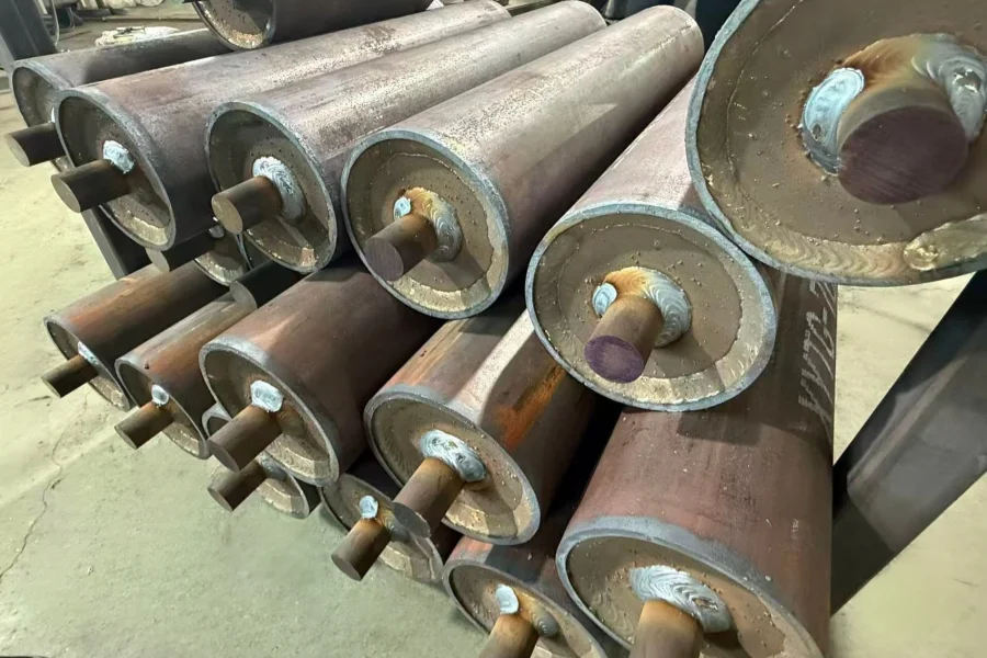 Welded live-shaft roller assemblies before final shaft journal machining